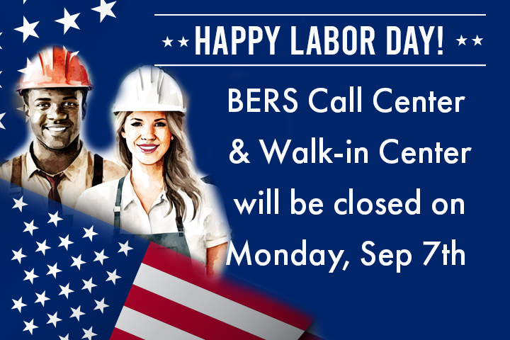 A smiling African American man and a young Caucasian woman both wear hard hats and stand behind an American flag.
                                           